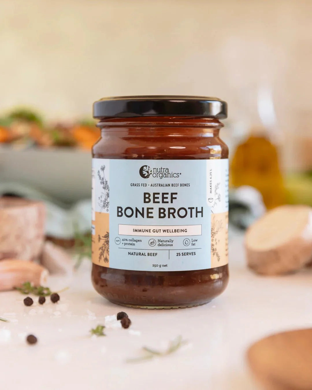 Jar of Nutra Organics Beef Bone Broth Concentrate - Natural - 250g with label highlighting gut wellbeing features