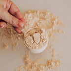 Hand holding a scoop of Beef Protein Isolate - Iced Latte - 450g powder by Switch Nutrition, New Arrivals collection.
