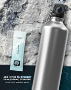 Clean Slate (Unflavoured) Electrolyte Drink Mix - 30 Sticks packet beside silver water bottle on textured salt surface by SALTT