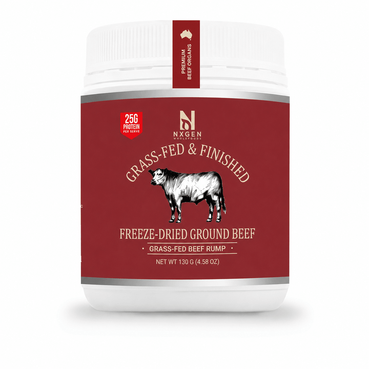 A white plastic tub of Nxsen Premium Beef Goulash with a deep red label featuring a black and white cow illustration and text reading 'Grass-Fed & Finished Freeze-Dried Ground Beef'.