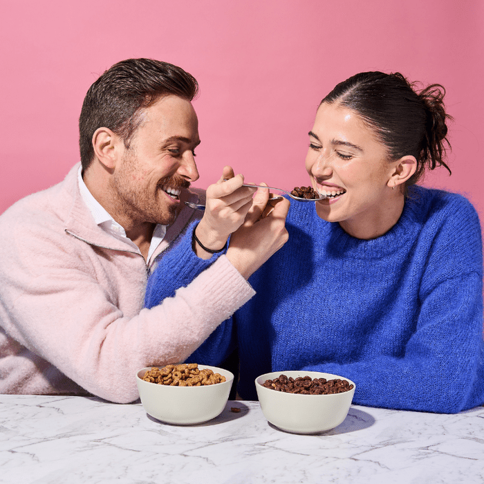 Couple enjoying Protein Cereal - Chocolate Flavour - 250g by Low Carb Emporium with Keto-friendly Love Low Carb branding