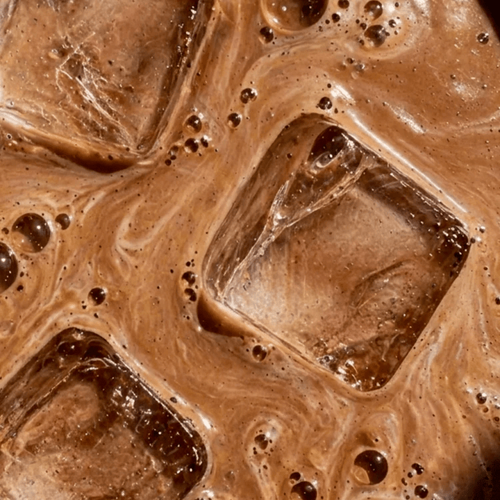 Close-up view of iced chocolate drink with creamy swirls, representing Sodii's Salty Chocolate - 30 Serve Tub, a keto-friendly low carb beverage.