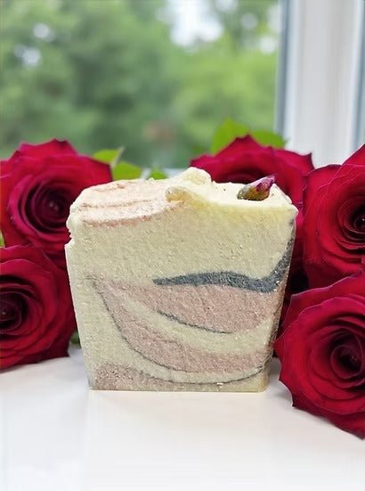 Tidal Blush Salt Bar Tallow Soap - 160g by The Bubble Jungle, surrounded by red roses on white surface